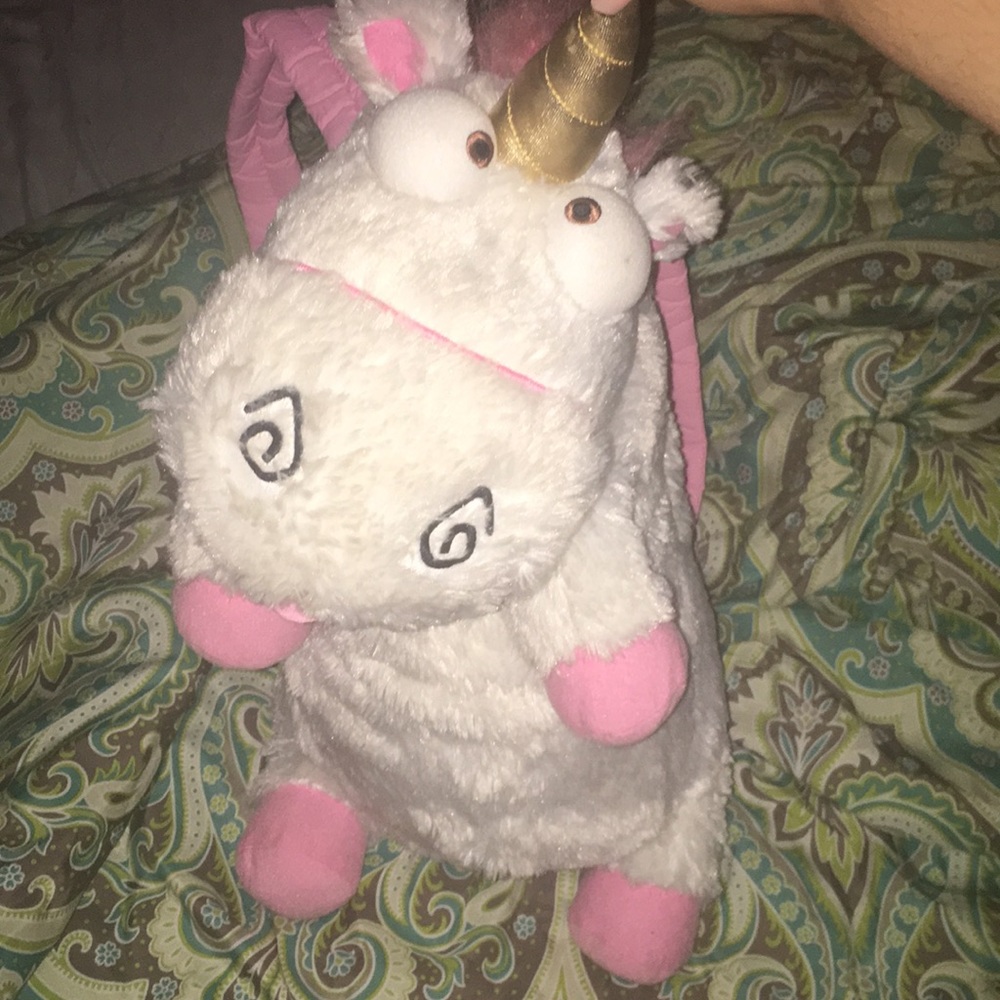 Fluffy the unicorn in back pack form